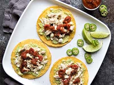 avocado chicken tostada on plate